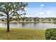 Serene lakefront property with lush landscaping at 1950 Marlington Way, Clearwater, FL 33763