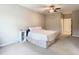 Bright bedroom with a comfortable bed and ceiling fan at 2010 E Palm Ave # 14304, Tampa, FL 33605