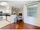 Open dining area with hardwood floors and kitchen access at 2010 E Palm Ave # 14304, Tampa, FL 33605