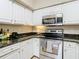 Kitchen features stainless steel appliances and granite countertops at 2010 E Palm Ave # 14304, Tampa, FL 33605