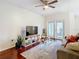 Living room with hardwood floors, a sofa, and access to a balcony at 2010 E Palm Ave # 14304, Tampa, FL 33605