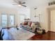 Living room with hardwood floors, a sofa, and access to a balcony at 2010 E Palm Ave # 14304, Tampa, FL 33605