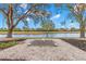 Zen garden with pond view, gravel, and Japanese lantern at 217 Linger Ln, Sun City Center, FL 33573