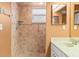 Bathroom with shower stall and updated vanity at 217 Linger Ln, Sun City Center, FL 33573