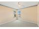 Empty bedroom with two windows and ceiling fan at 217 Linger Ln, Sun City Center, FL 33573