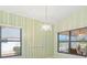 Bright dining room with light green walls and chandelier at 217 Linger Ln, Sun City Center, FL 33573