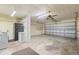 Garage with washer, dryer, and extra storage at 217 Linger Ln, Sun City Center, FL 33573