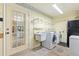 Laundry room with washer, dryer, and sink at 217 Linger Ln, Sun City Center, FL 33573