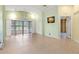 Open living area with tile floors and access to patio at 217 Linger Ln, Sun City Center, FL 33573