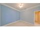 Light blue bedroom with ceiling fan and closet at 217 Oceania Ct, Apollo Beach, FL 33572