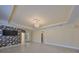 Dining room featuring decorative wallpaper, chandelier, and access to patio at 217 Oceania Ct, Apollo Beach, FL 33572