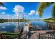 Kayaks on a community dock overlooking a calm lake at 217 Oceania Ct, Apollo Beach, FL 33572