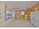 Bright kitchen with light wood cabinets, window seat and white appliances at 217 Oceania Ct, Apollo Beach, FL 33572