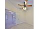 Bright office space with ceiling fan and view into adjacent living area at 217 Oceania Ct, Apollo Beach, FL 33572