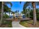 playground surrounded by palm trees at 217 Oceania Ct, Apollo Beach, FL 33572