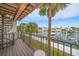 Waterfront balcony with seating area and spiral staircase at 224 Skiff Pt # 224, Clearwater Beach, FL 33767