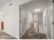 Bright hallway with doors to bedrooms and bathrooms at 224 Skiff Pt # 224, Clearwater Beach, FL 33767