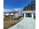 White single story home with carport and landscaped lawn at 2241 Greenwich Dr # 2241, Sun City Center, FL 33573