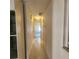 Hallway with tile flooring leading to bedrooms at 2241 Greenwich Dr # 2241, Sun City Center, FL 33573