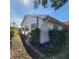 Side view of house showing the AC unit and landscaping at 2241 Greenwich Dr # 2241, Sun City Center, FL 33573