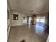 Spacious living room with tile floors and view to the patio at 2241 Greenwich Dr # 2241, Sun City Center, FL 33573