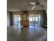 Bright living room featuring tile floors and patio access at 2241 Greenwich Dr # 2241, Sun City Center, FL 33573