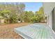 Large backyard with shed and mature trees at 2255 S Lagoon Cir, Clearwater, FL 33765