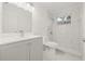 Clean bathroom with gray vanity, marble shower, and updated fixtures at 2255 S Lagoon Cir, Clearwater, FL 33765