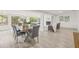 Modern dining room with gray chairs and wood table at 2255 S Lagoon Cir, Clearwater, FL 33765