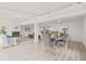 Bright dining room with a wooden table and gray chairs at 2255 S Lagoon Cir, Clearwater, FL 33765