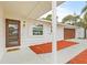 Front porch with modern door and red mulch at 2255 S Lagoon Cir, Clearwater, FL 33765