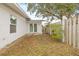 Side yard with a wooden fence at 2255 S Lagoon Cir, Clearwater, FL 33765