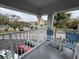 Balcony with two chairs and view of parking lot at 2449 Columbia Dr # 55, Clearwater, FL 33763