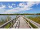 Wooden dock extending over calm lake water at 2449 Columbia Dr # 55, Clearwater, FL 33763