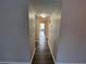 Hallway with dark vinyl flooring at 2449 Columbia Dr # 55, Clearwater, FL 33763