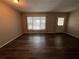 Living room with dark vinyl flooring at 2449 Columbia Dr # 55, Clearwater, FL 33763