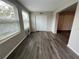 Bright living room with gray flooring and access to the balcony at 2449 Columbia Dr # 55, Clearwater, FL 33763