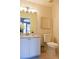 Well-lit half bathroom with a vanity and modern fixtures at 2577 Estancia Blvd, Clearwater, FL 33761