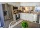 Modern kitchen featuring stainless steel appliances and white cabinets at 2577 Estancia Blvd, Clearwater, FL 33761