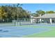 Well-maintained tennis courts with surrounding greenery at 2577 Estancia Blvd, Clearwater, FL 33761