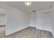 Spacious bedroom with wood-look floors and double-door closet at 2901 Forestwood Dr, Seffner, FL 33584