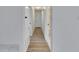 Bright hallway with light wood-look flooring at 2901 Forestwood Dr, Seffner, FL 33584