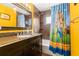 Bathroom with a tub, shower, and a mario themed shower curtain at 29836 69Th N Way, Clearwater, FL 33761