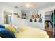 Main bedroom with a yellow comforter and guitars displayed on the wall at 29836 69Th N Way, Clearwater, FL 33761