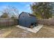 Large storage shed in backyard with a wooden exterior at 29836 69Th N Way, Clearwater, FL 33761