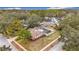 Aerial view of house with pool and fenced backyard at 3005 Enisglen Dr, Palm Harbor, FL 34683