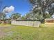 Backyard with a fence and landscaping at 3005 Enisglen Dr, Palm Harbor, FL 34683