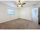 Spacious bedroom with ceiling fan and large closet at 3005 Enisglen Dr, Palm Harbor, FL 34683