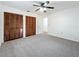 Bedroom with double closets and carpet flooring at 3005 Enisglen Dr, Palm Harbor, FL 34683