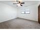 Spacious bedroom with ceiling fan and carpet at 3005 Enisglen Dr, Palm Harbor, FL 34683